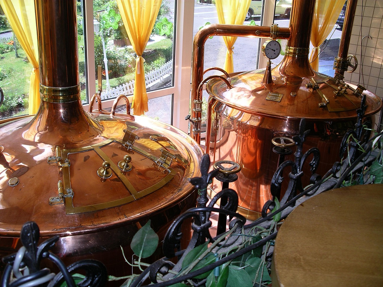 Traditional copper brewing kettles in Bard Brews